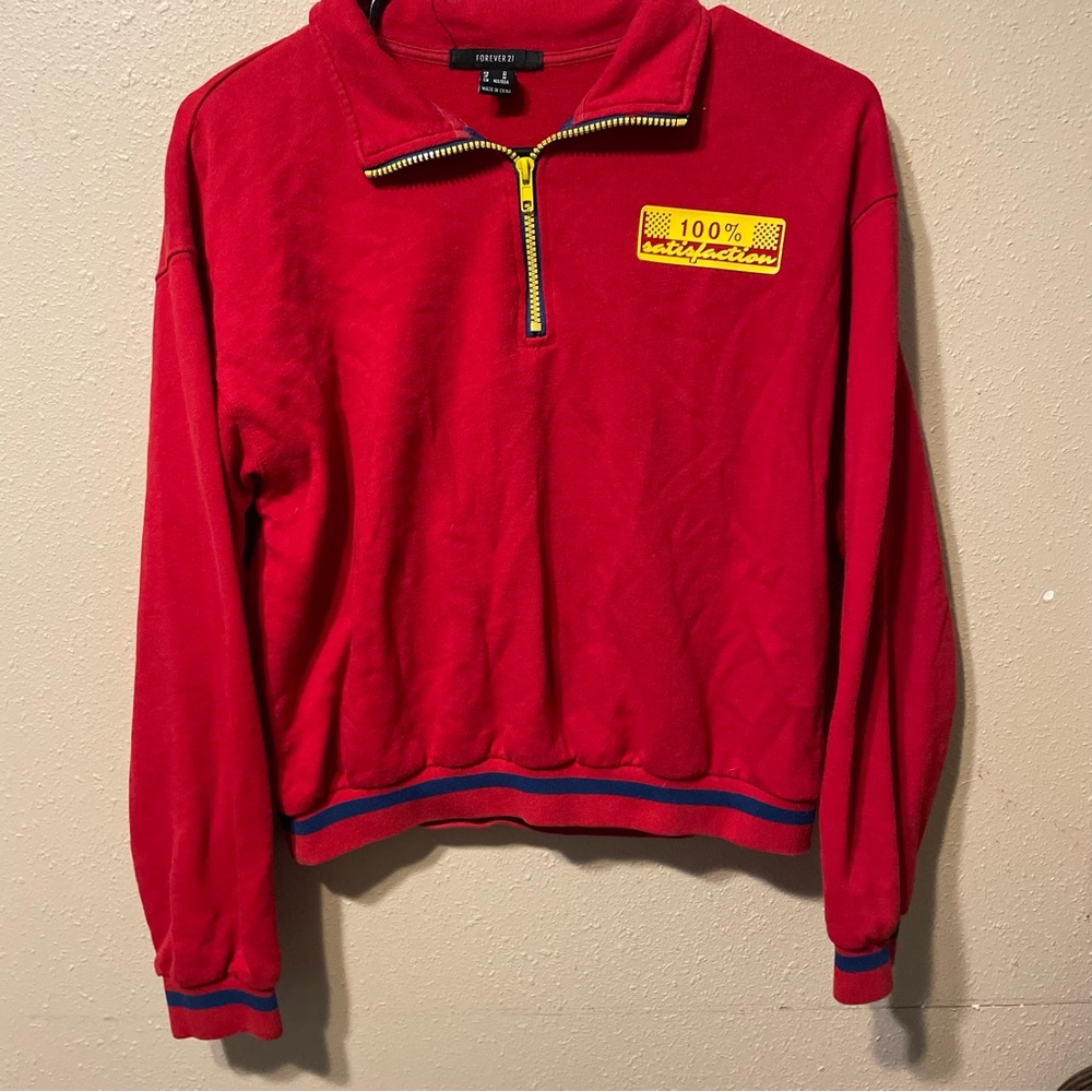 Red long sleeve with yellow accents “100% satisfaction”